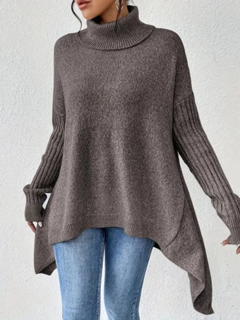 Women's oversized turtleneck sweater with asymmetrical hem