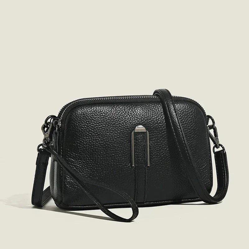 Women's leather shoulder bag with double zip closure and metal accent – Black