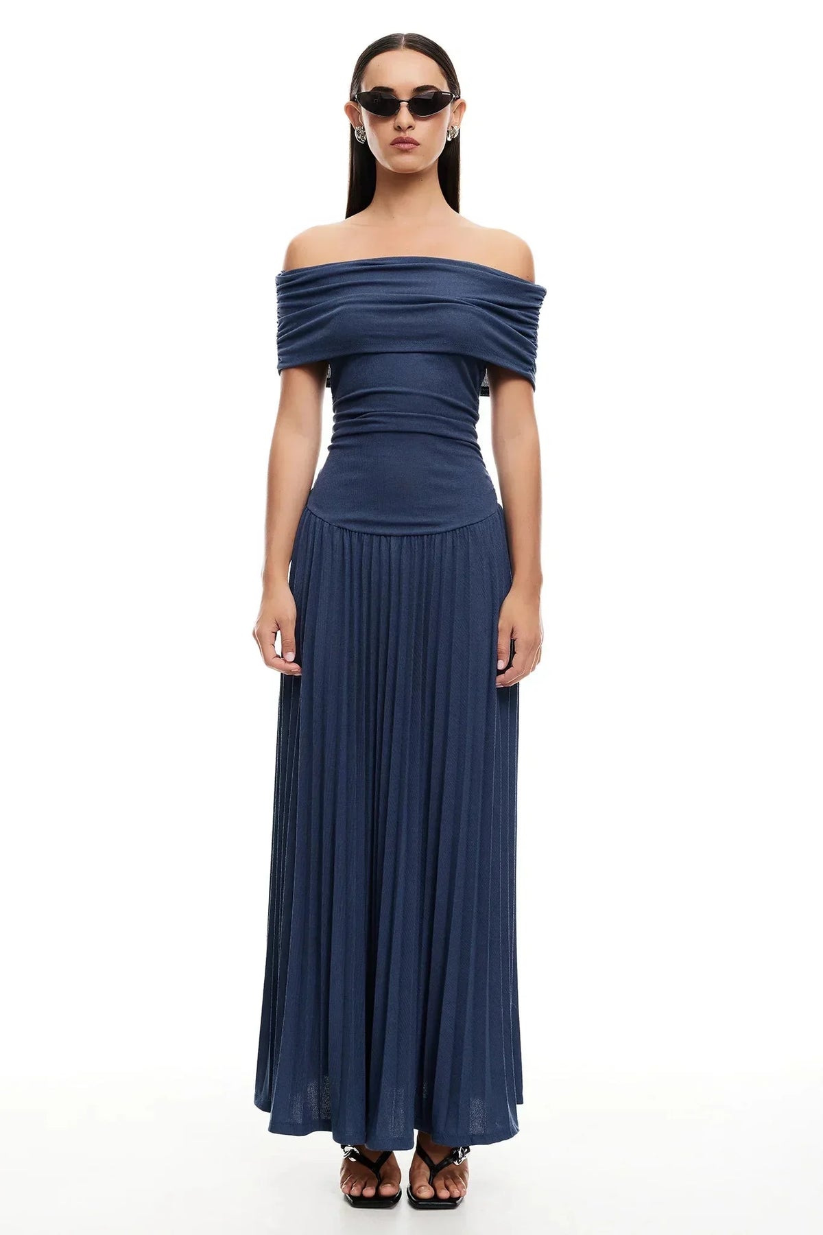 Women's flowy summer maxi dress with off-shoulder neckline and pleated skirt