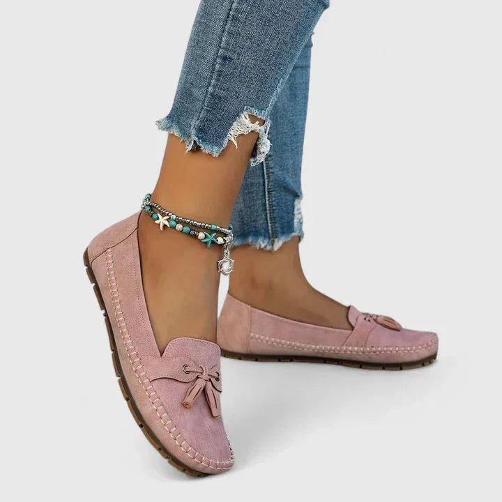 Women's suede slip-on moccasin flat loafers with tasseled bow detail
