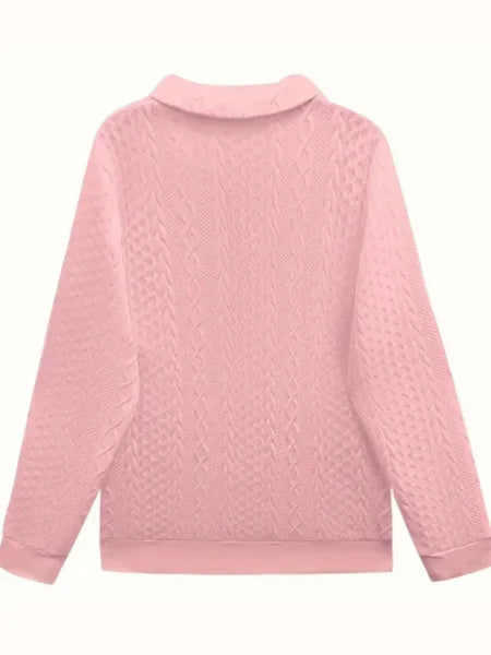 Women's textured knit sweater with quarter-zip closure and long sleeves