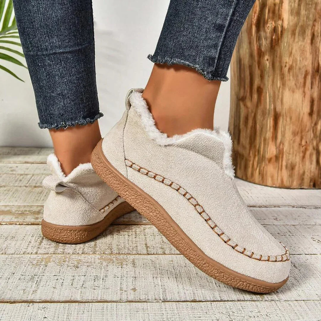 Women's warm fur-lined slip-on ankle boots with thick sole and moc-toe stitching
