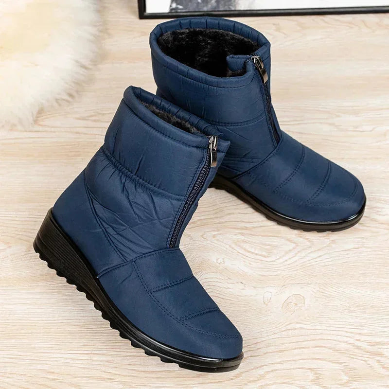 Women's waterproof quilted mid-calf winter boots with velcro strap closure