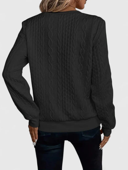 Women's cable knit pullover sweater with V-neckline detail