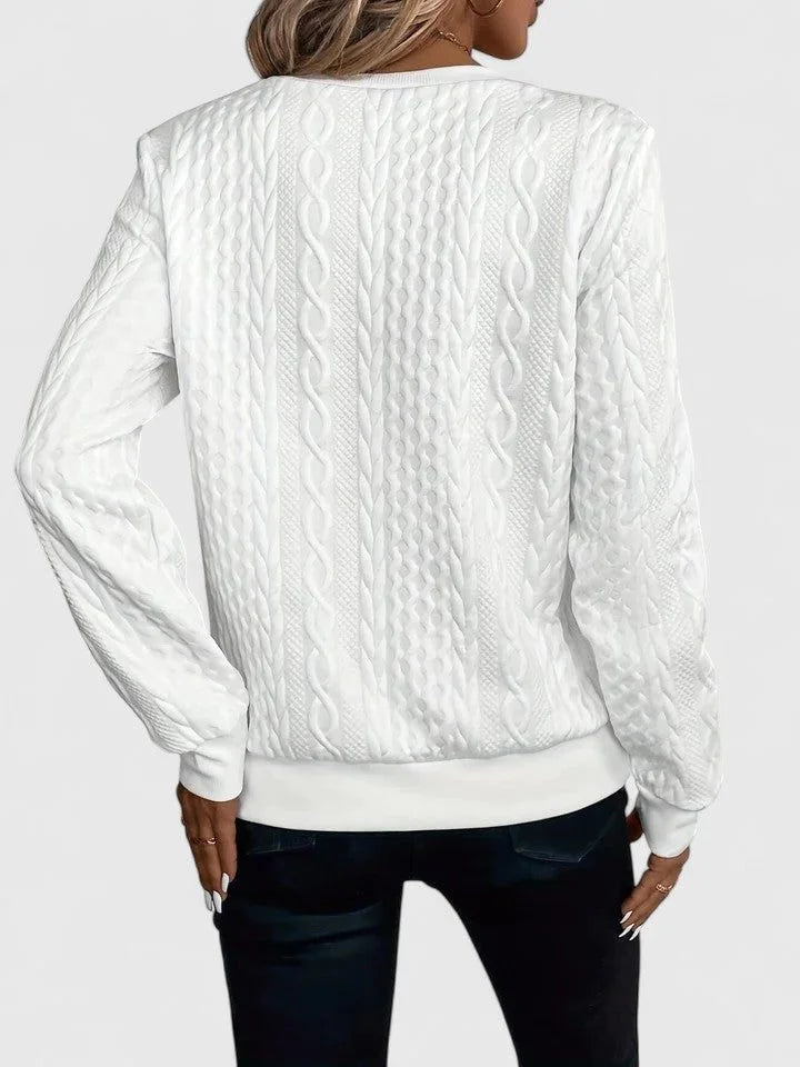 Women's cable knit pullover sweater with V-neckline detail