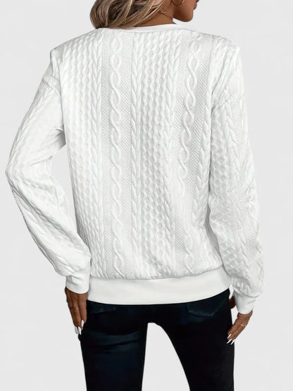Women's cable knit pullover sweater with V-neckline detail
