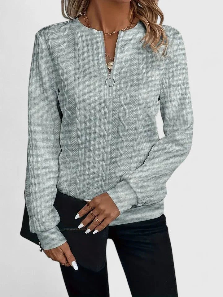 Women's cable knit pullover sweater with V-neckline detail