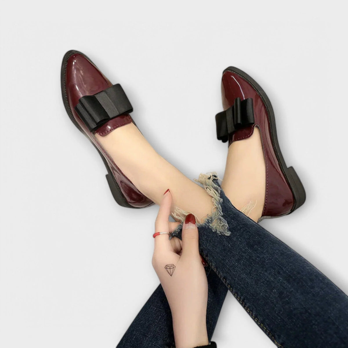 Women's faux leather loafers with bow detail