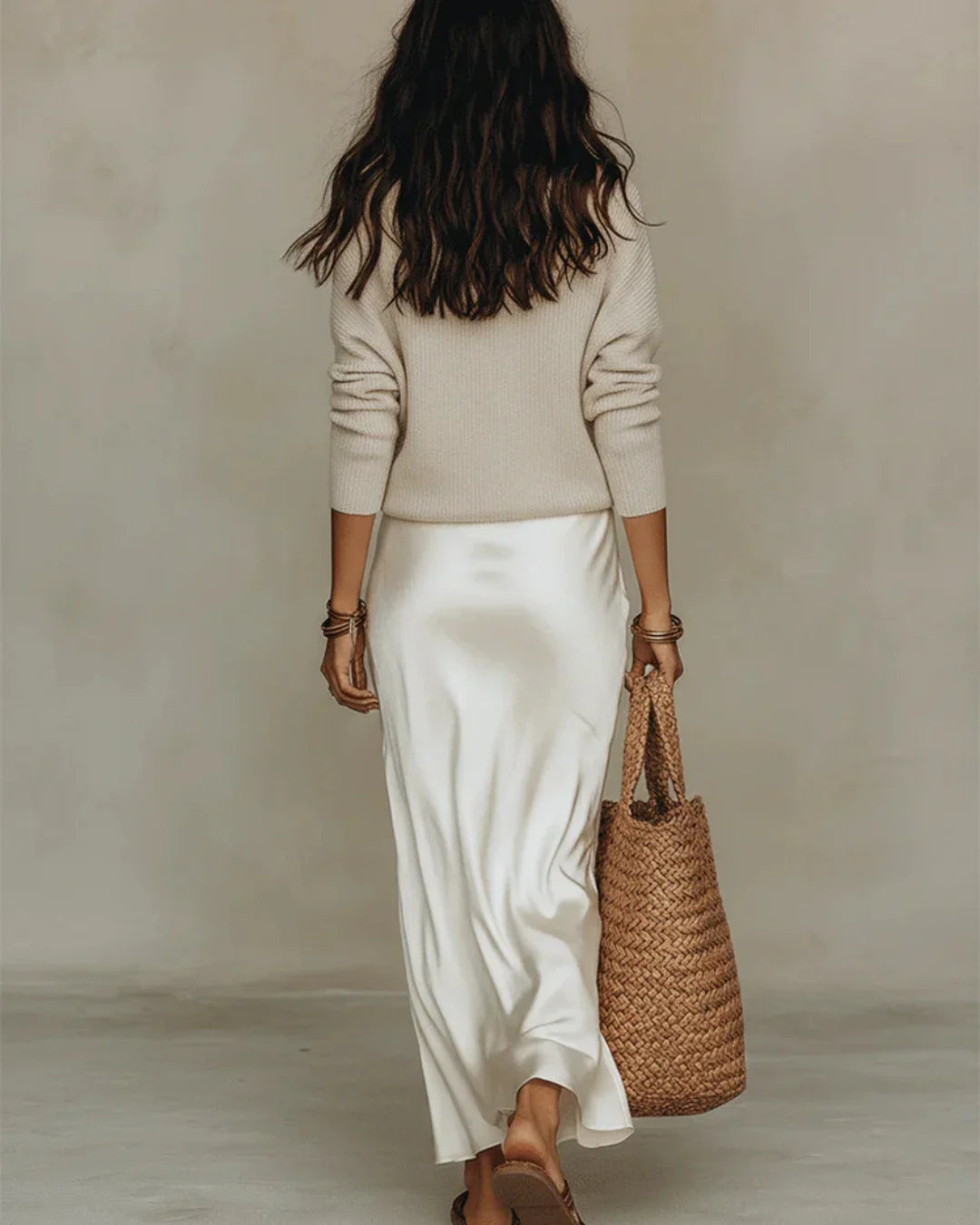 Women's ribbed knit sweater and satin wrap skirt two-piece set