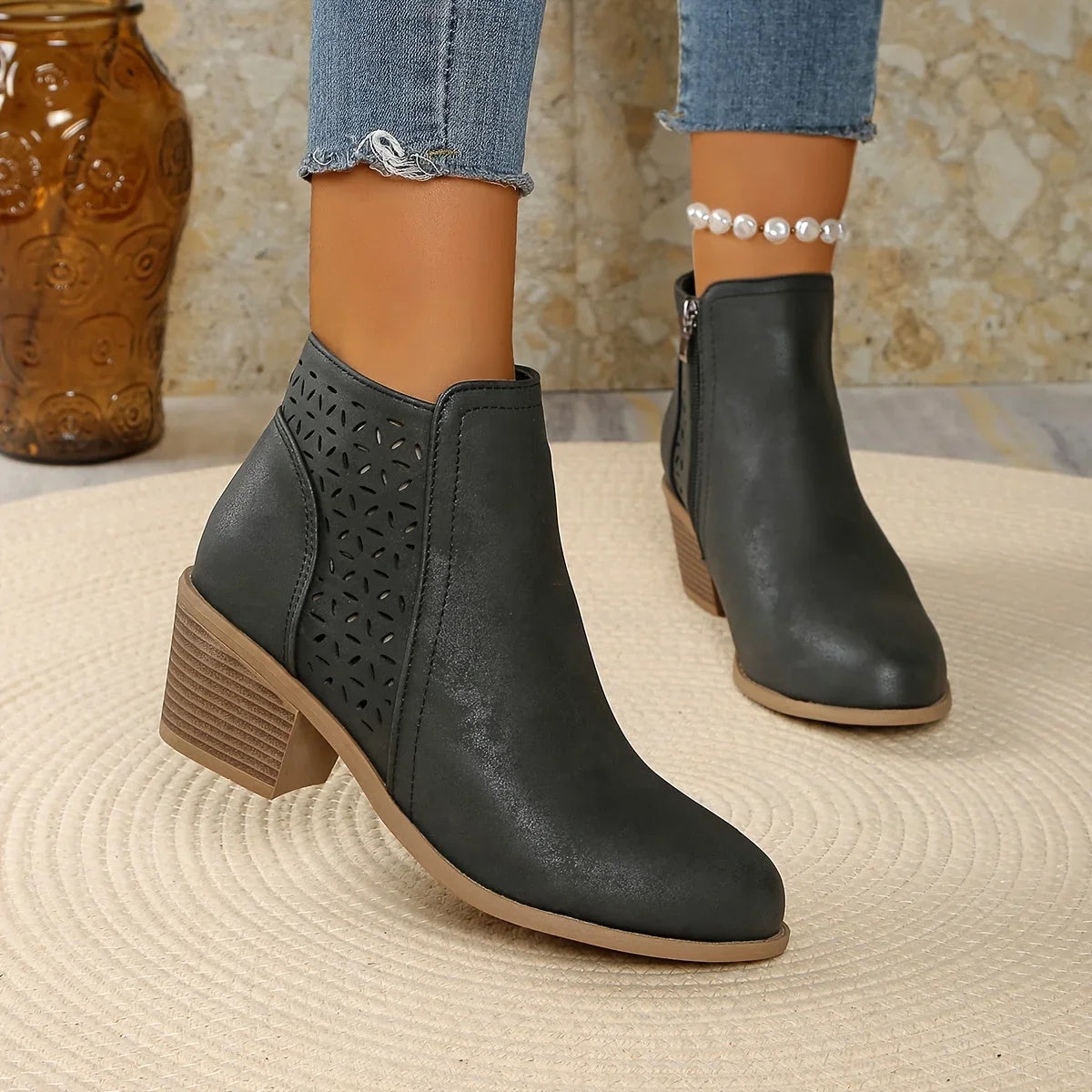 Women's supportive ankle boots with laser-cut detailing