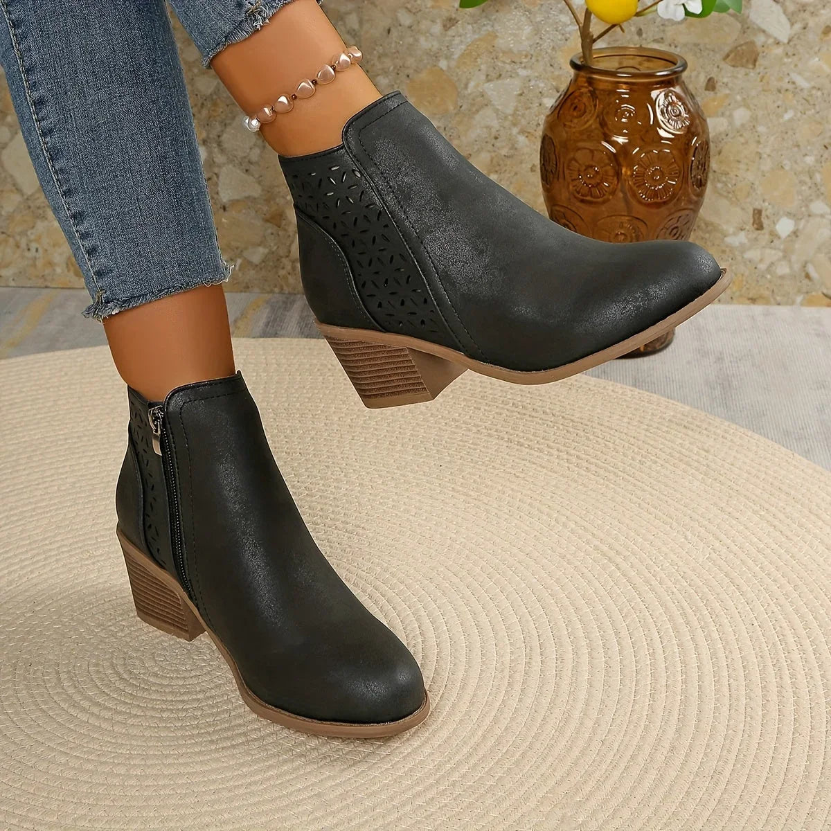 Women's supportive ankle boots with laser-cut detailing