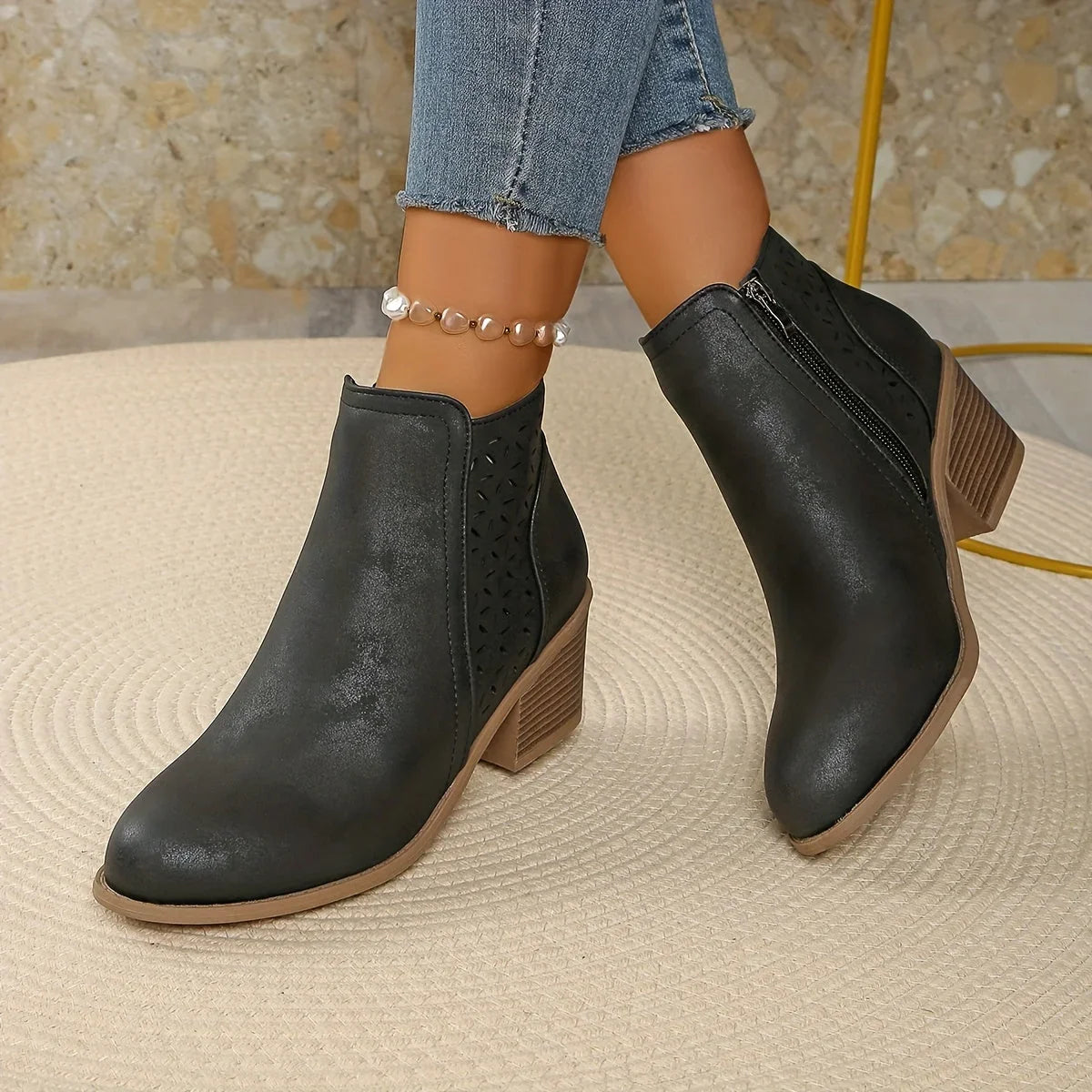 Women's supportive ankle boots with laser-cut detailing
