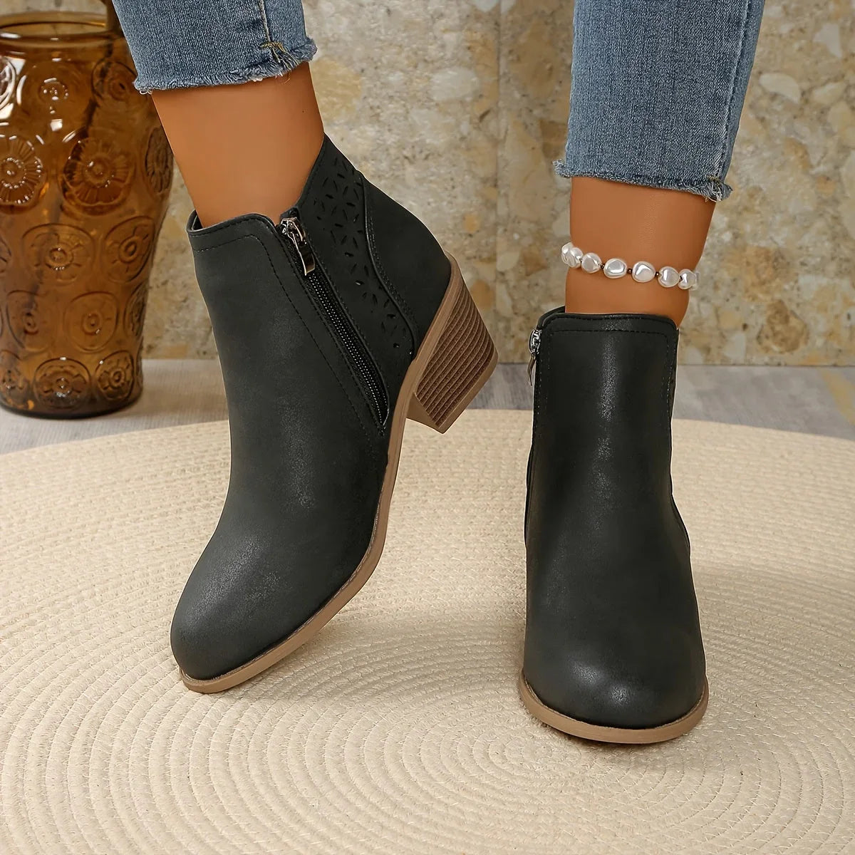 Women's supportive ankle boots with laser-cut detailing