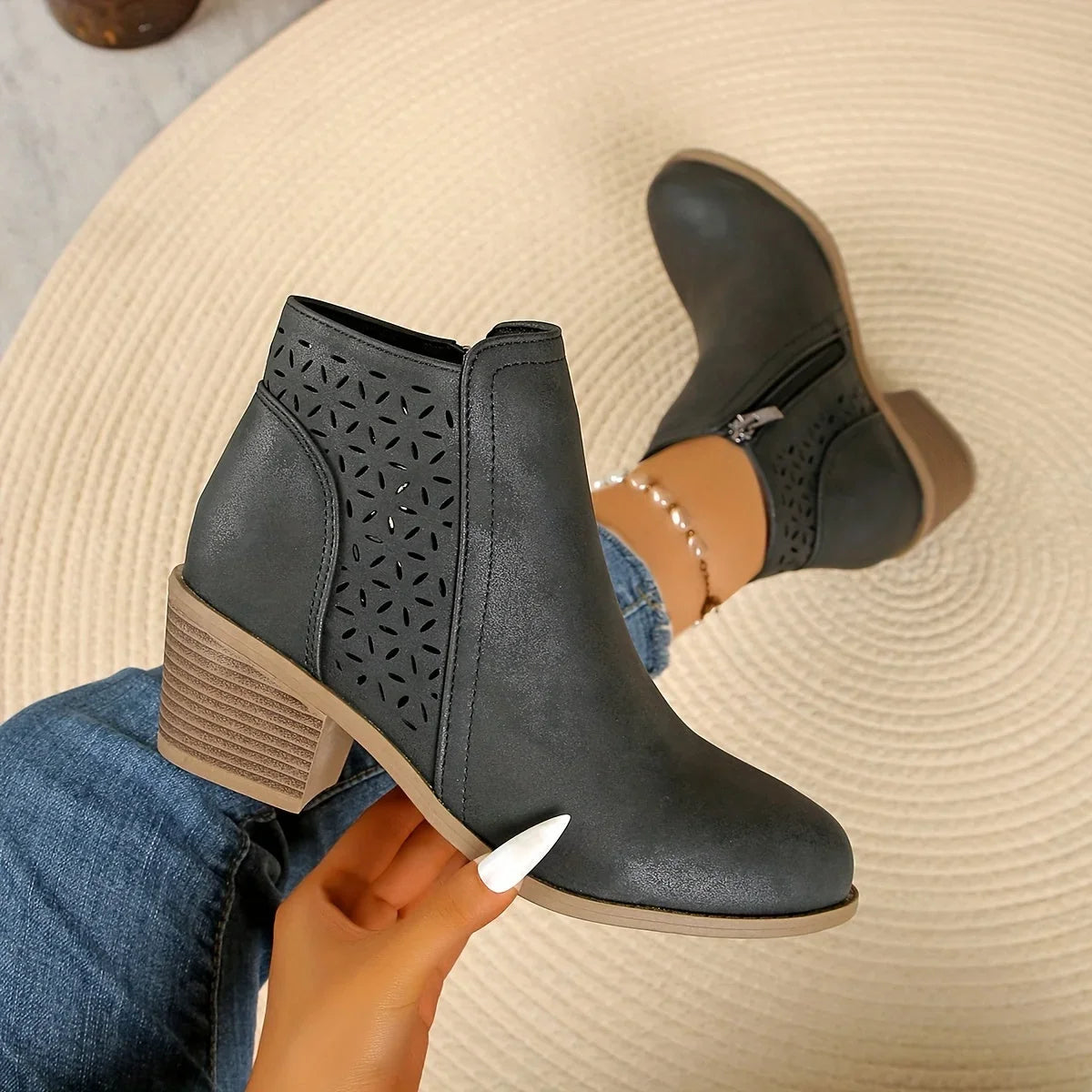 Women's supportive ankle boots with laser-cut detailing
