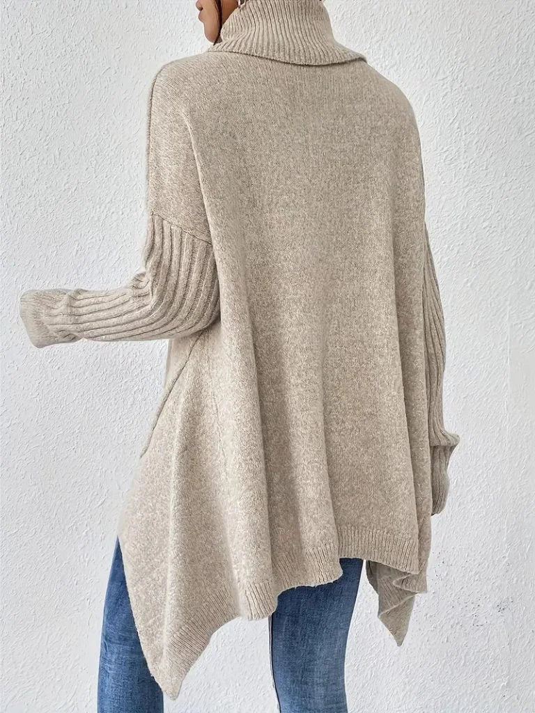 Women's oversized turtleneck sweater with asymmetrical hem