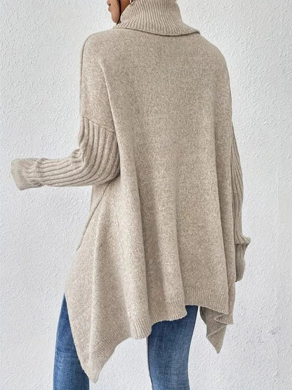 Women's oversized turtleneck sweater with asymmetrical hem