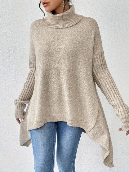 Women's oversized turtleneck sweater with asymmetrical hem
