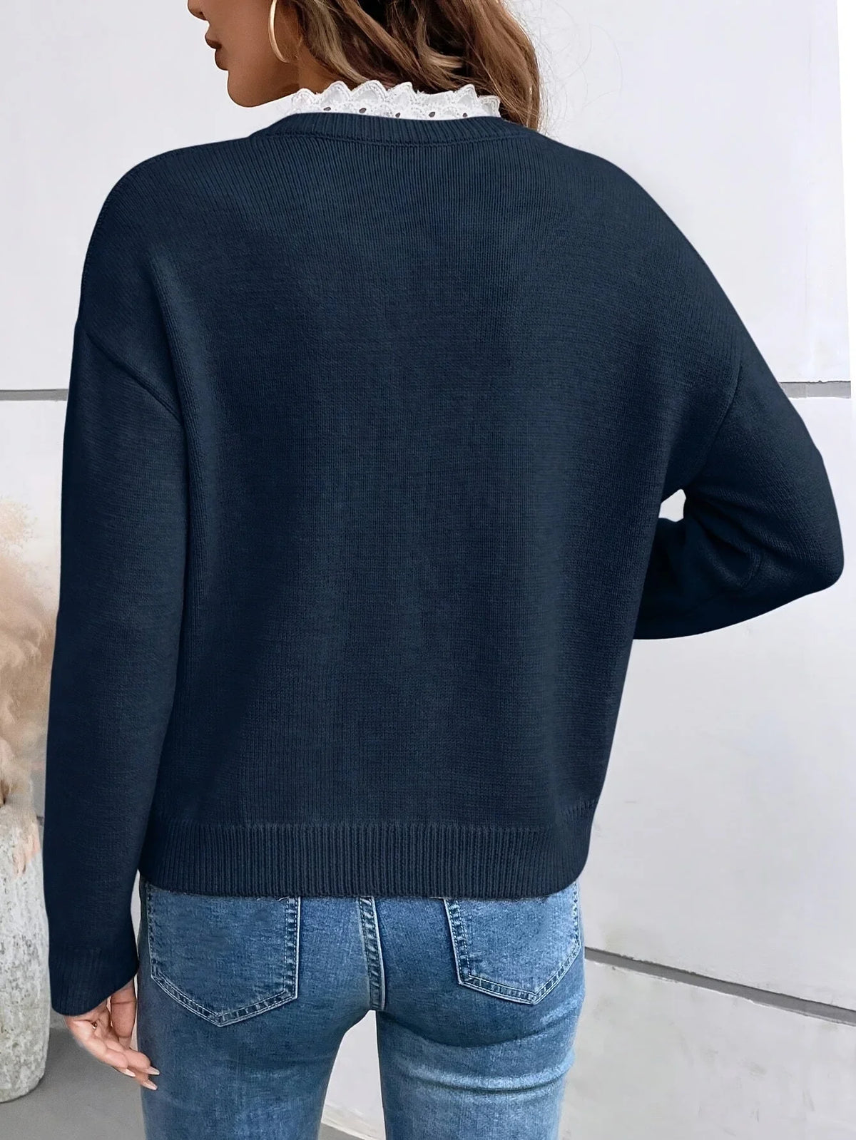 Women's ribbed knit V-neck blouse with lace collar detail