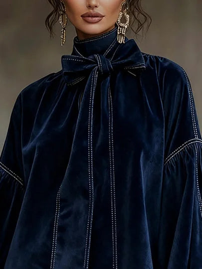 Women's velvet mini dress with bow neckline and puffy sleeves
