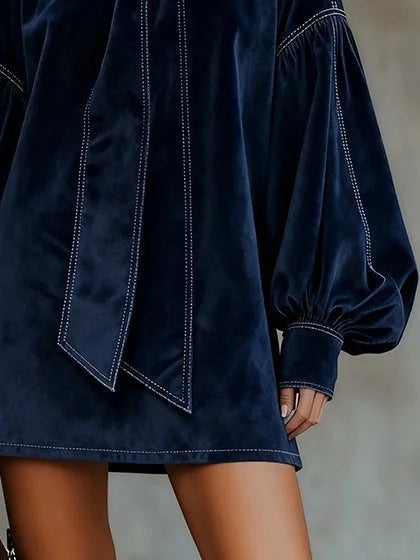 Women's velvet mini dress with bow neckline and puffy sleeves