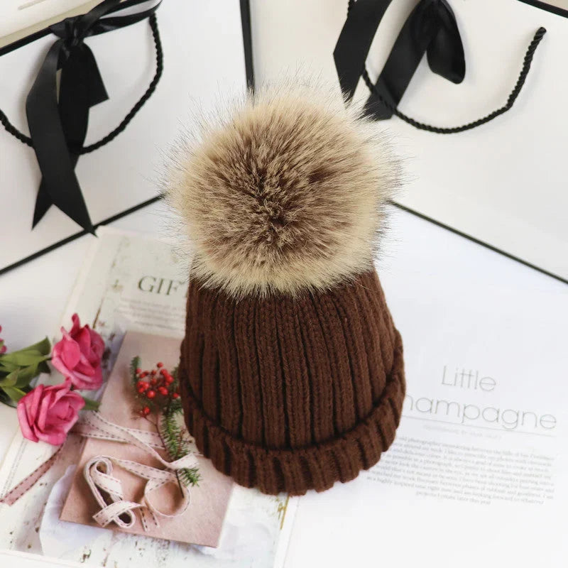 Women's cozy knit sweater-style beanie with faux fur pom – Brown