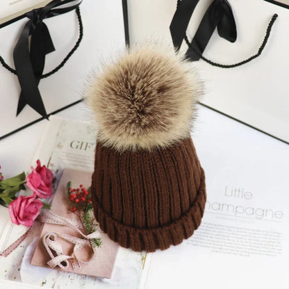Women's cozy knit sweater-style beanie with faux fur pom – Brown