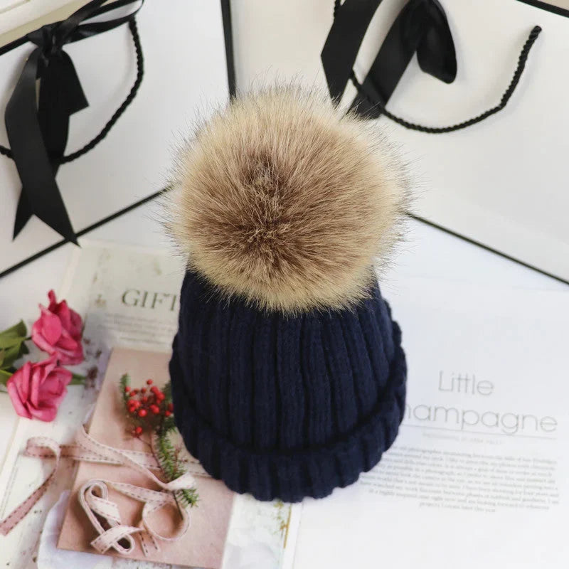 Women's cozy knit sweater-style beanie with faux fur pom – Navy