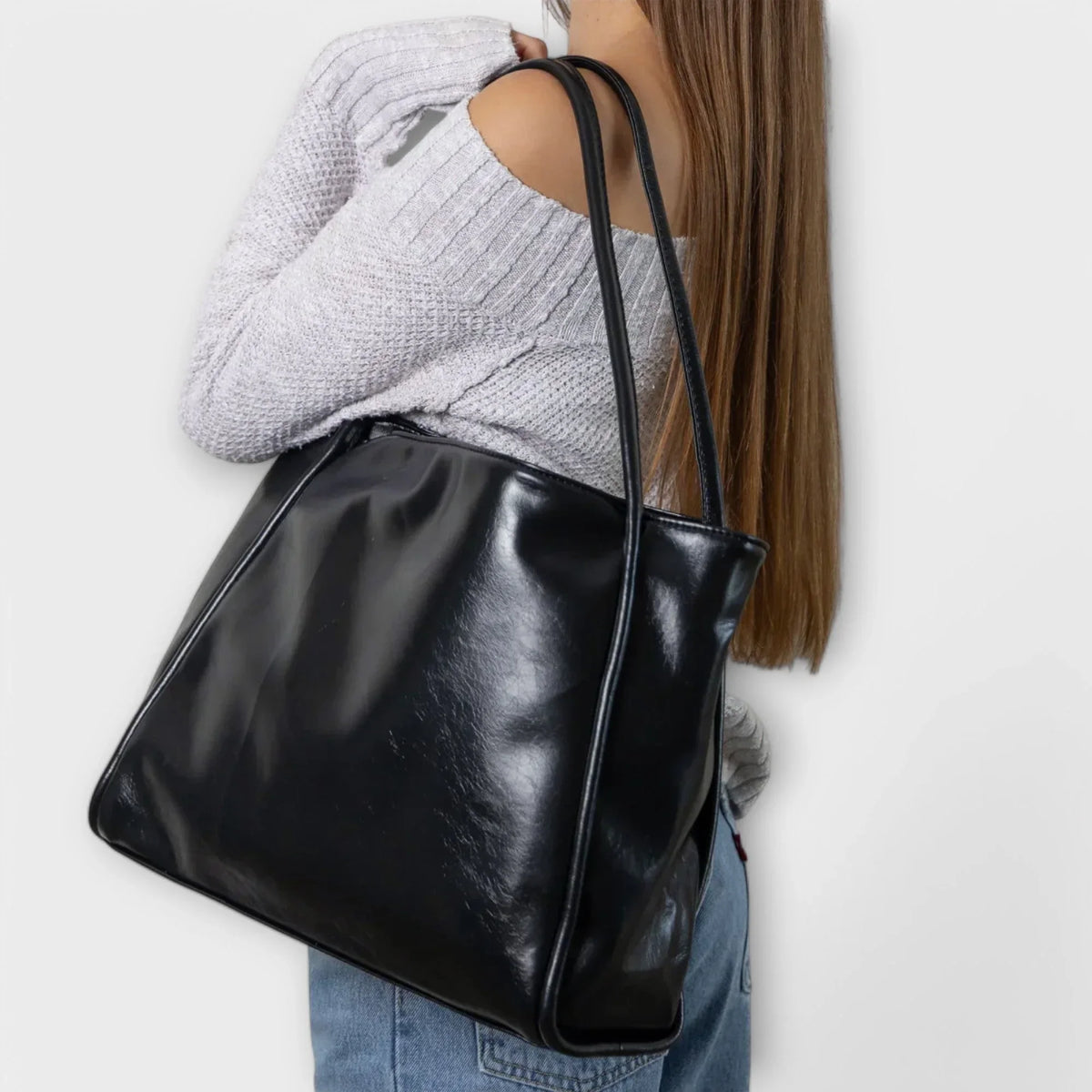 Women's faux-leather tote bag with open-top and thin straps