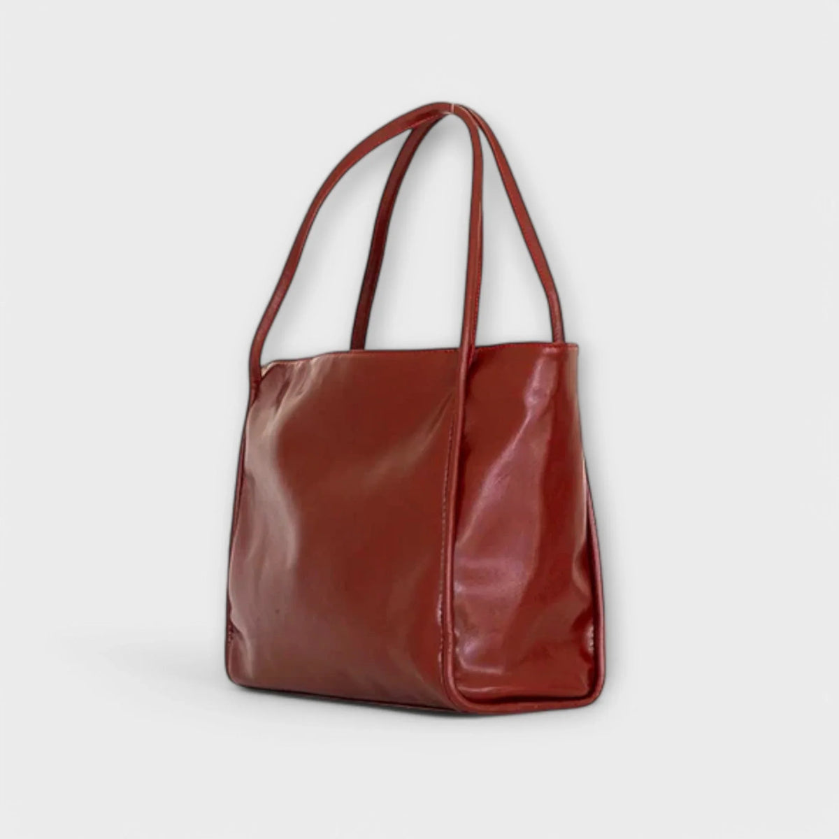Women's faux-leather tote bag with open-top and thin straps
