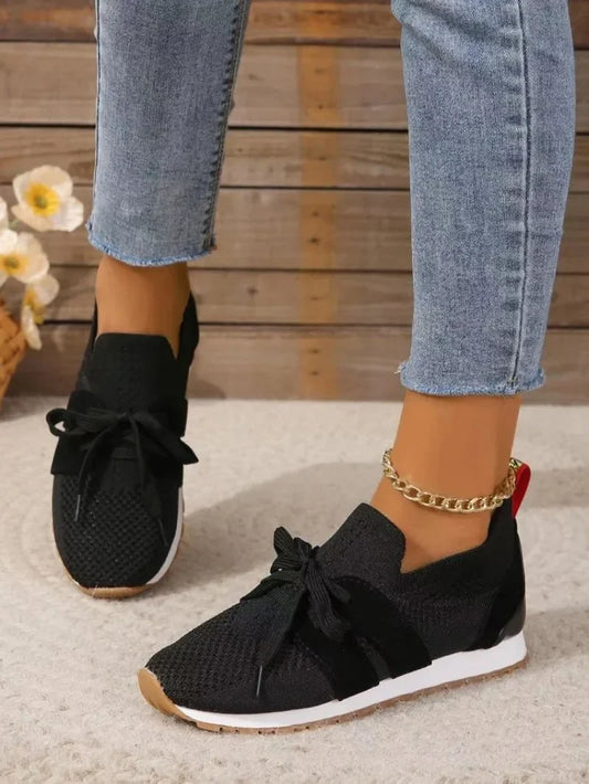 Women's knit slip-on sneakers with bow-knot laces and striped sides