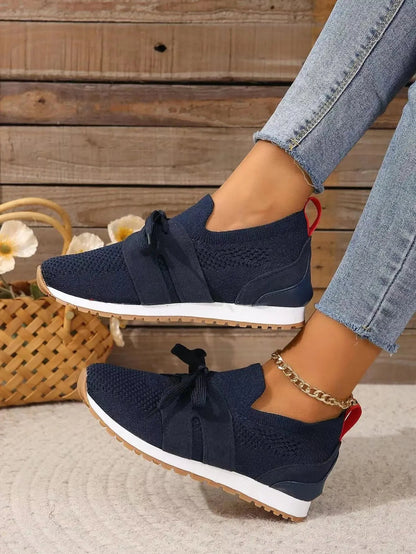 Women's knit slip-on sneakers with bow-knot laces and striped sides