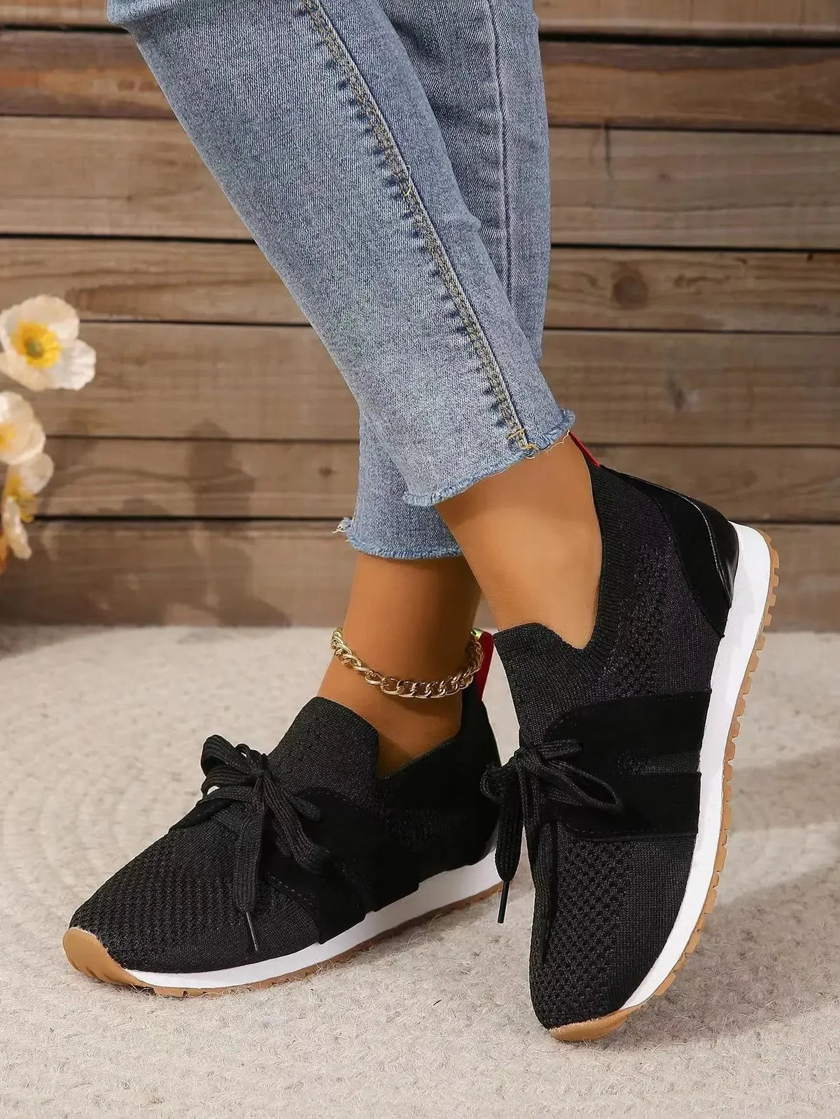 Women's knit slip-on sneakers with bow-knot laces and striped sides – Black