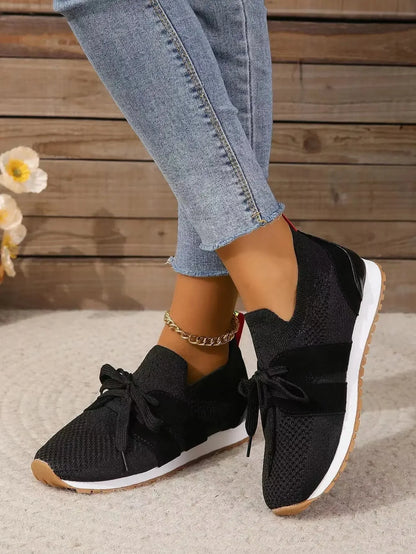 Women's knit slip-on sneakers with bow-knot laces and striped sides – Black