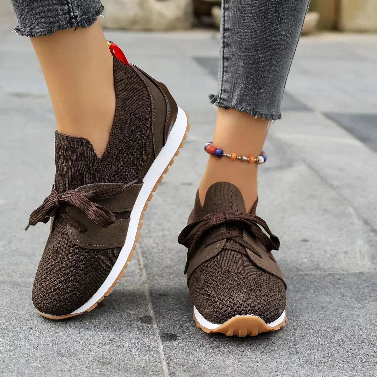 Women's knit slip-on sneakers with bow-knot laces and striped sides – Brown