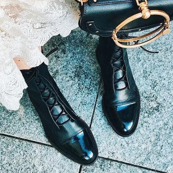 Women's leather heeled pointed-toe boots with lace-up cap-toe design
