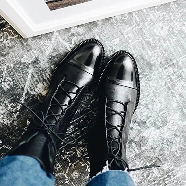 Women's leather heeled pointed-toe boots with lace-up cap-toe design