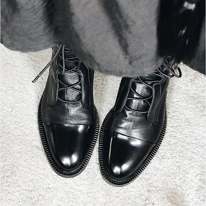 Women's leather heeled pointed-toe boots with lace-up cap-toe design