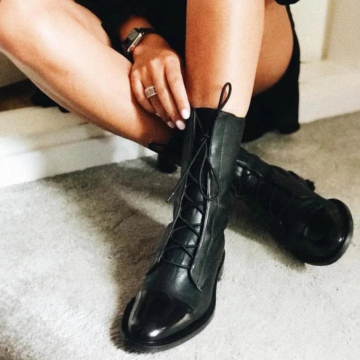Women's leather heeled pointed-toe boots with lace-up cap-toe design