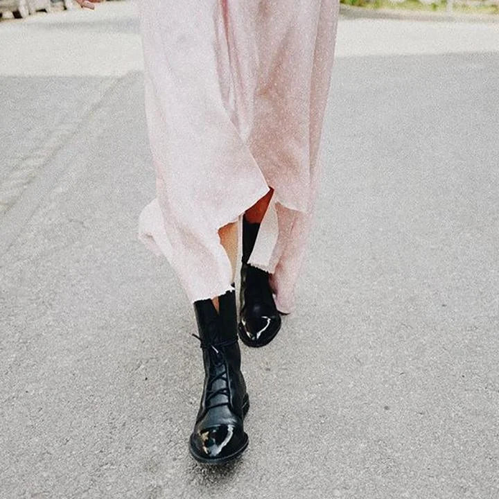 Women's leather heeled pointed-toe boots with lace-up cap-toe design