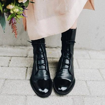 Women's leather heeled pointed-toe boots with lace-up cap-toe design – Black