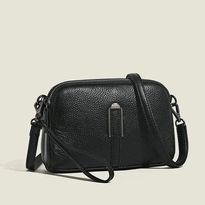 Women's leather shoulder bag with double zip closure and metal accent – Black
