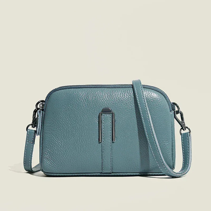 Women's leather shoulder bag with double zip closure and metal accent – Blue