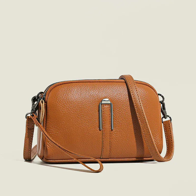 Women's leather shoulder bag with double zip closure and metal accent – Brown