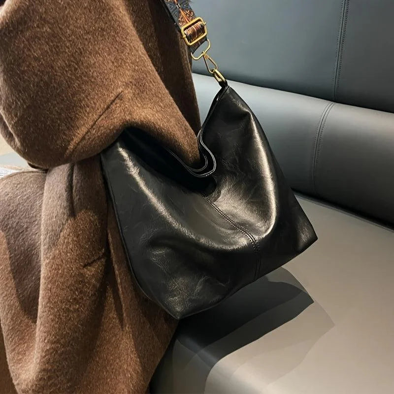Women's faux-leather hobo bag with bohemian-patterned wide strap