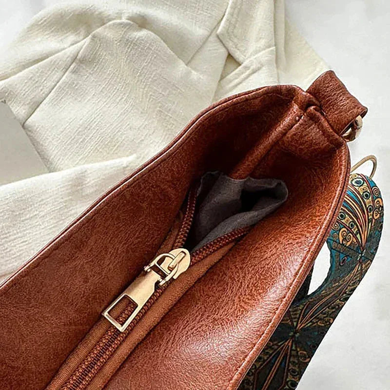 Women's faux-leather hobo bag with bohemian-patterned wide strap