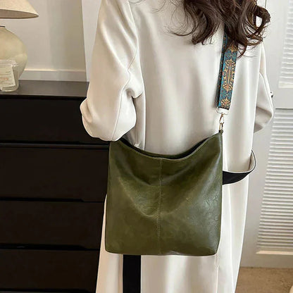 Women's faux-leather hobo bag with bohemian-patterned wide strap