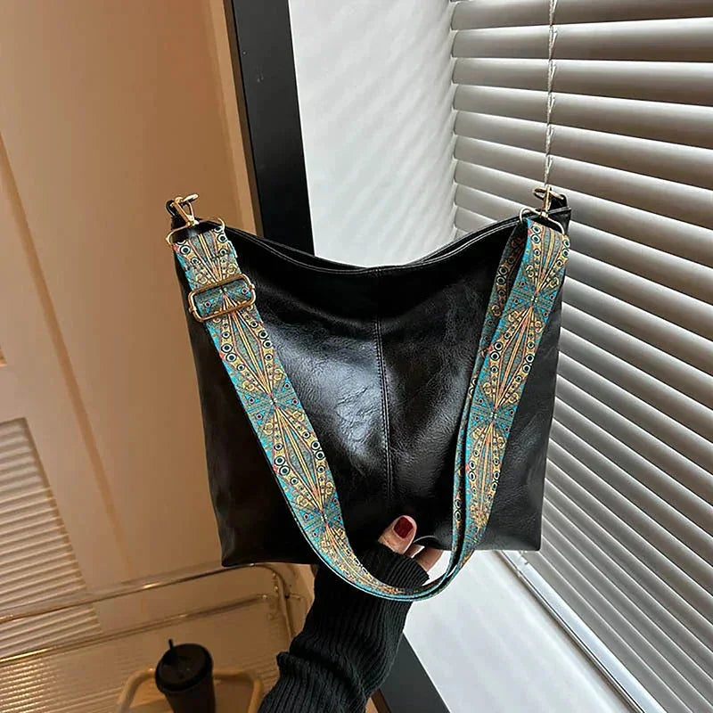 Women's faux-leather hobo bag with bohemian-patterned wide strap – Black