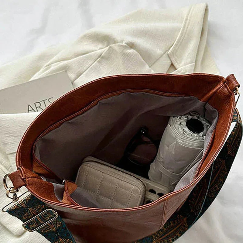 Women's faux-leather hobo bag with bohemian-patterned wide strap