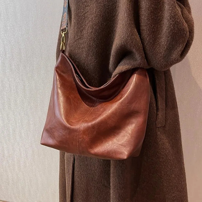 Women's faux-leather hobo bag with bohemian-patterned wide strap