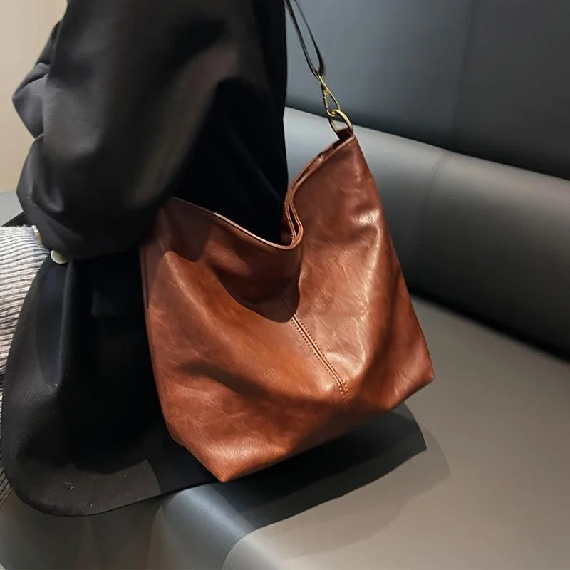 Women's faux-leather hobo bag with bohemian-patterned wide strap